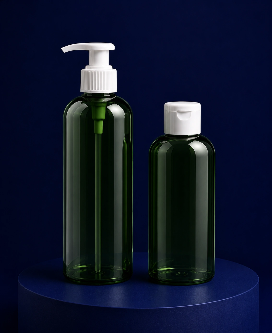 Two dark green bottles, one with a pump dispenser and one with a flip-cap, on a blue pedestal against a navy background.